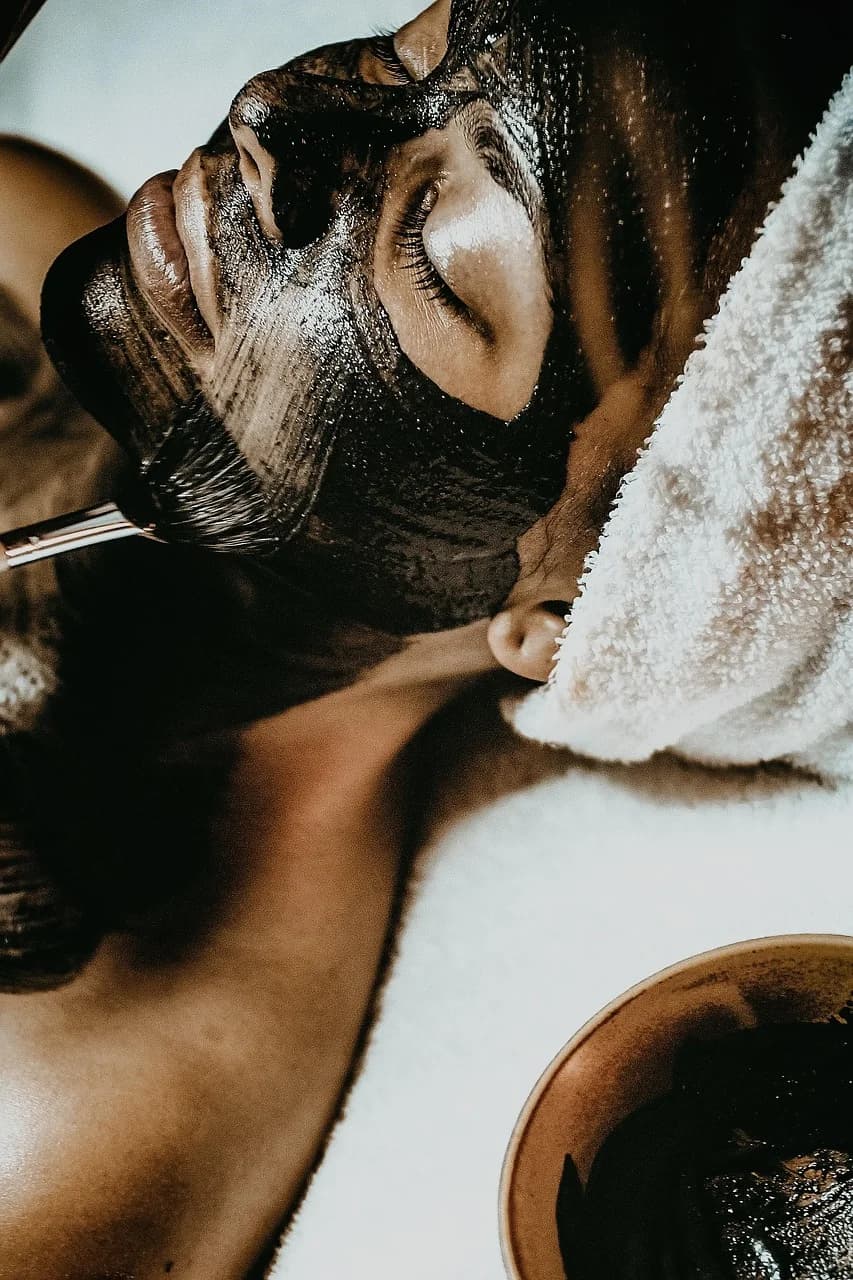 Woman receiving a facial treatment at a spa