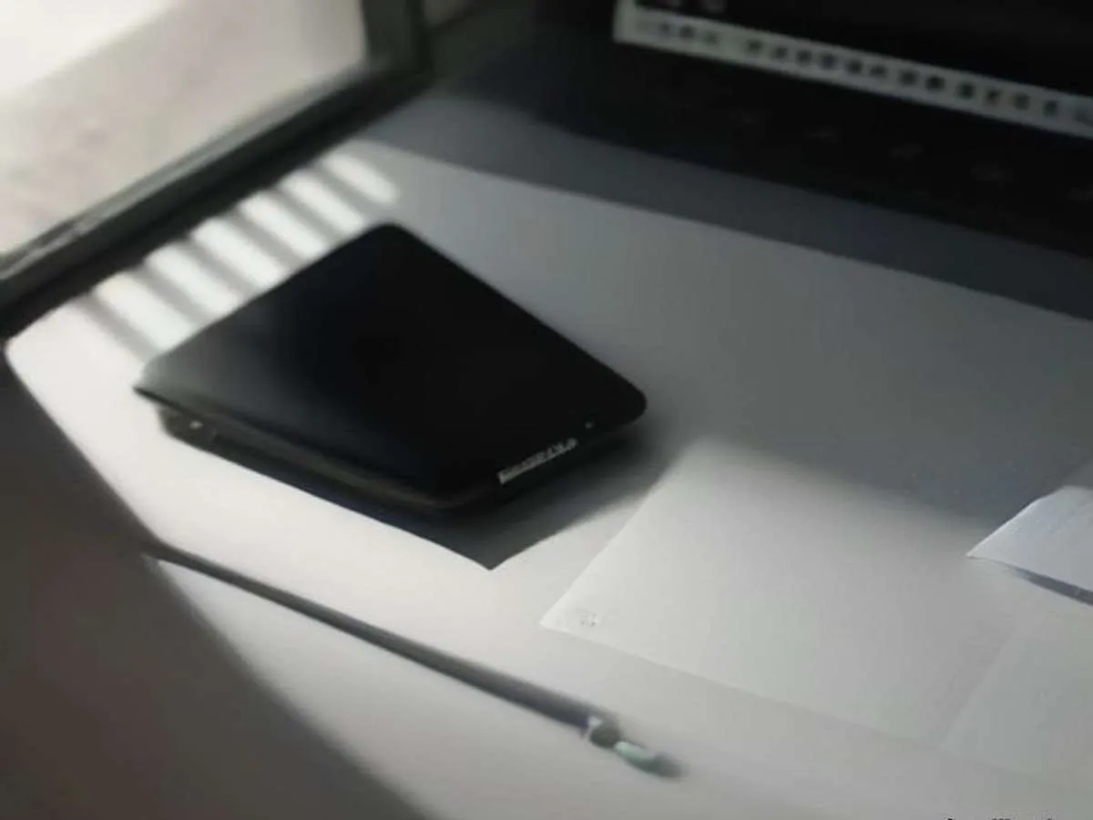 Laptop and phone on a desk ready for WordPress plugin updates and backup